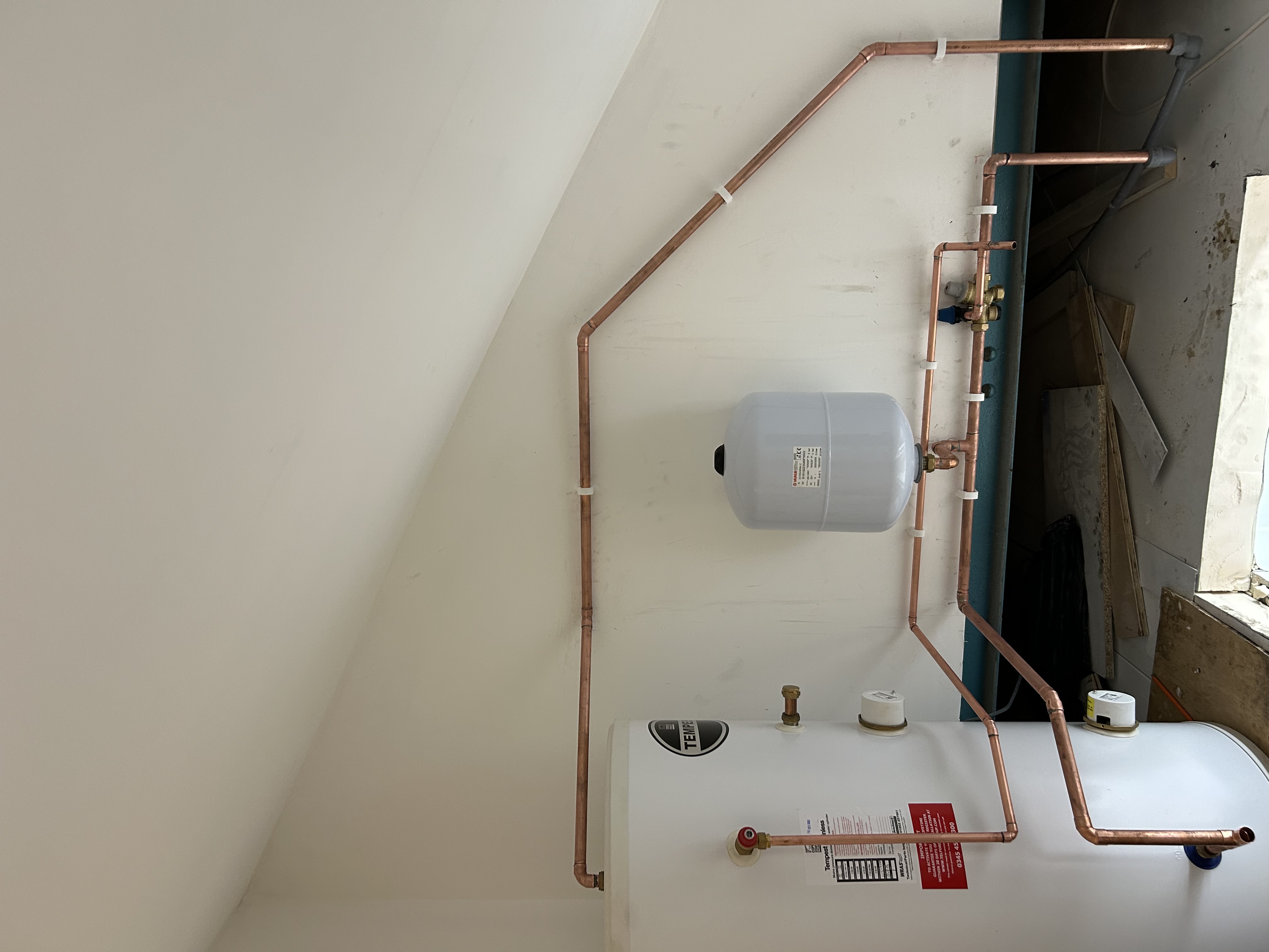 Central heating expansion vessel and copper pipework by Flow Plus Plumbing